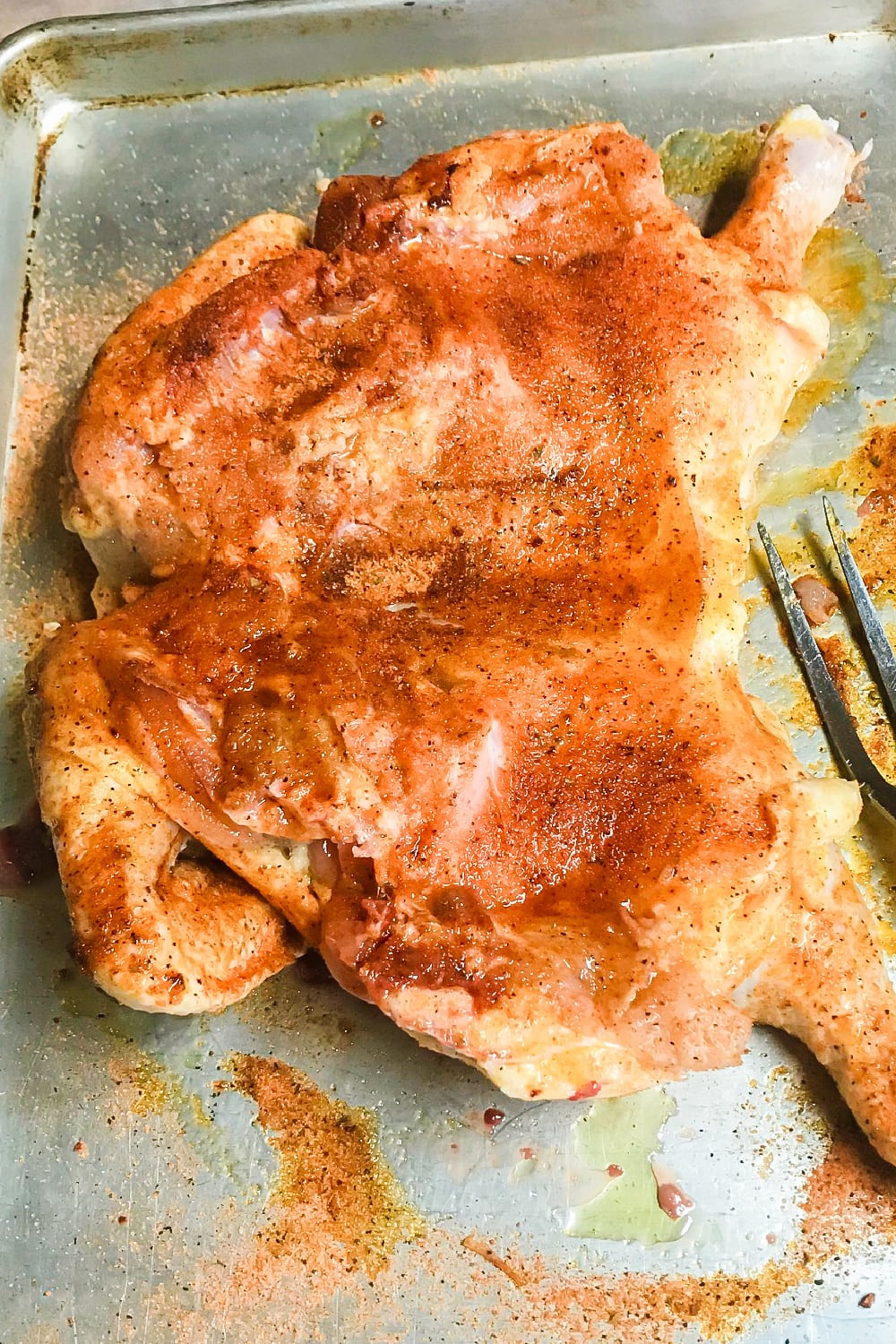 Seasoned rib side of whole chicken. 