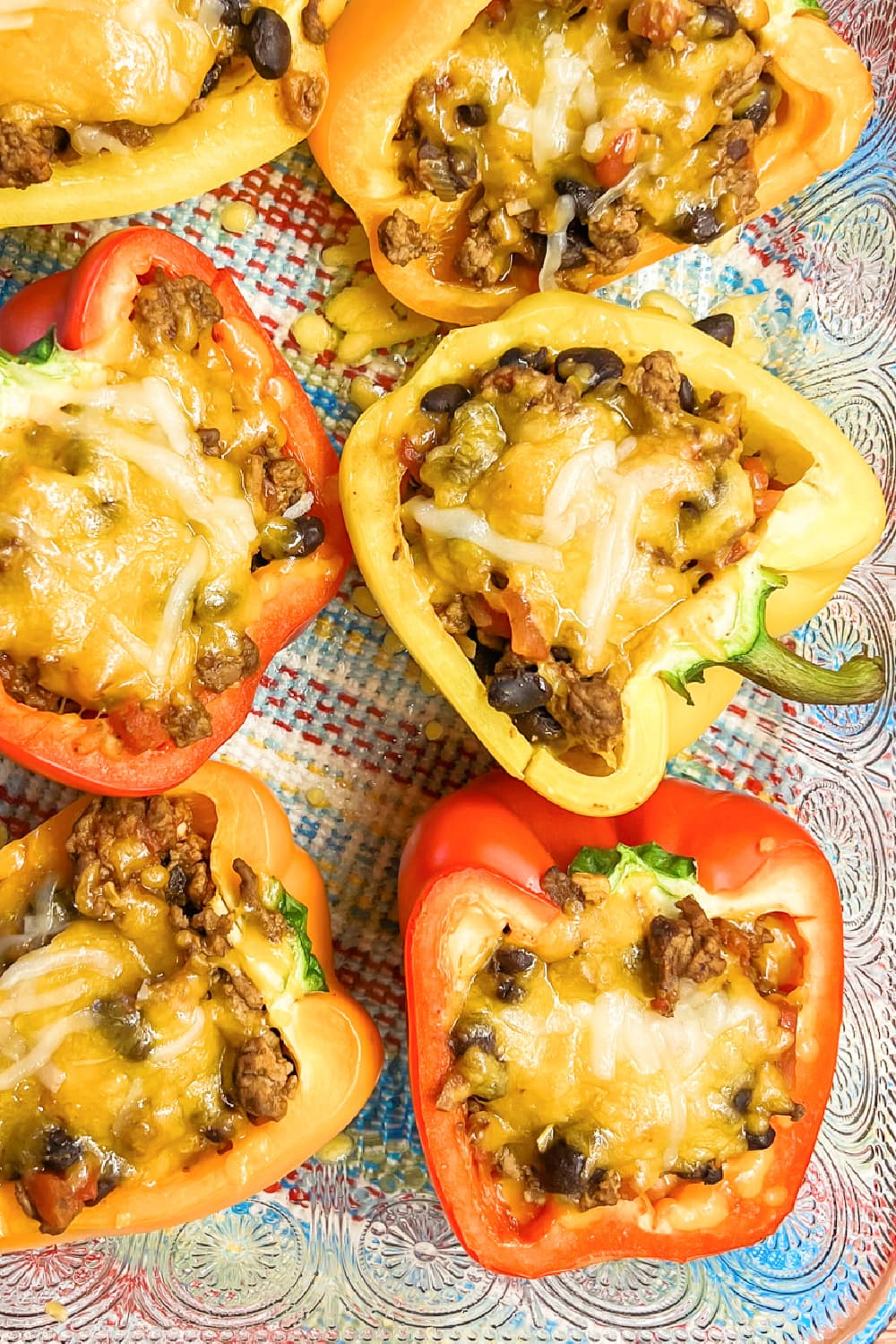 Hot and fresh stuffed bell peppers with cheese on top.