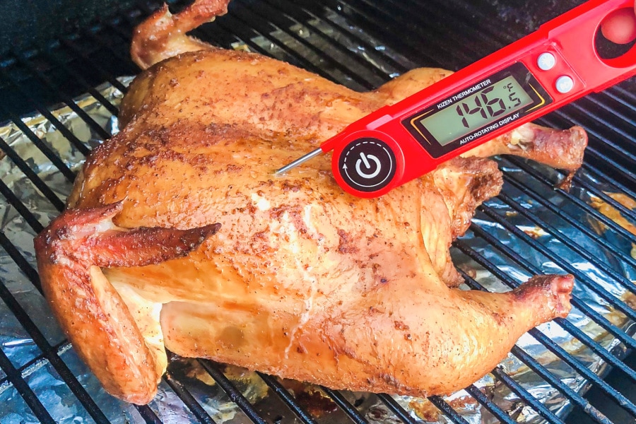 Checking the internal temperature of a chicken. 