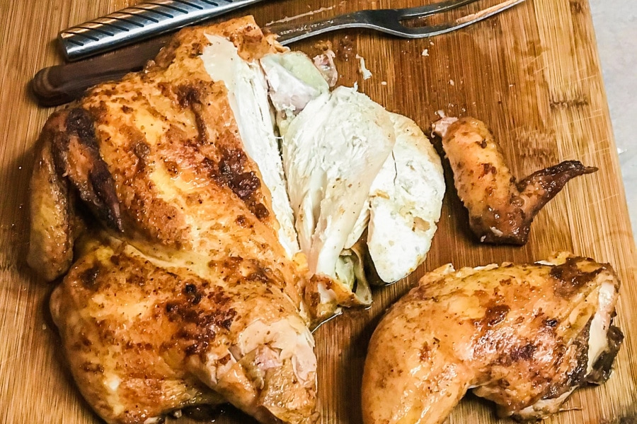 Carving a smoked chicken. 