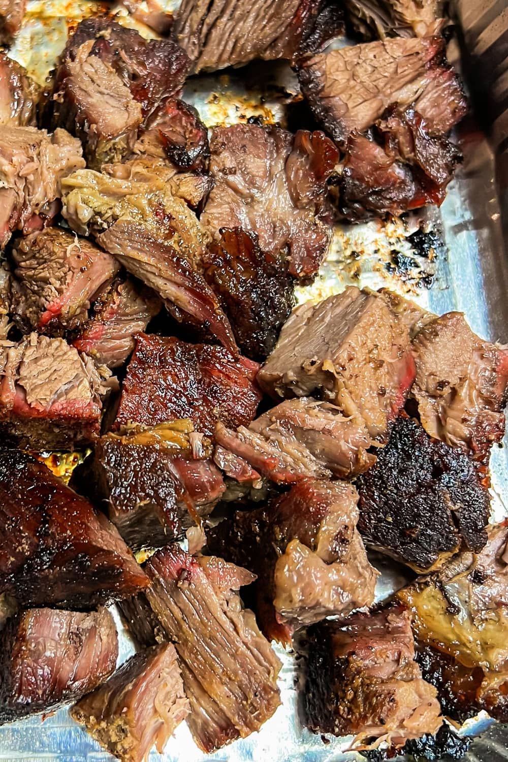 Chuck roast that has been cut into cubes for smoker burnt ends. 