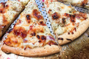 Cream Cheese Chicken Bacon Pizza in slices.