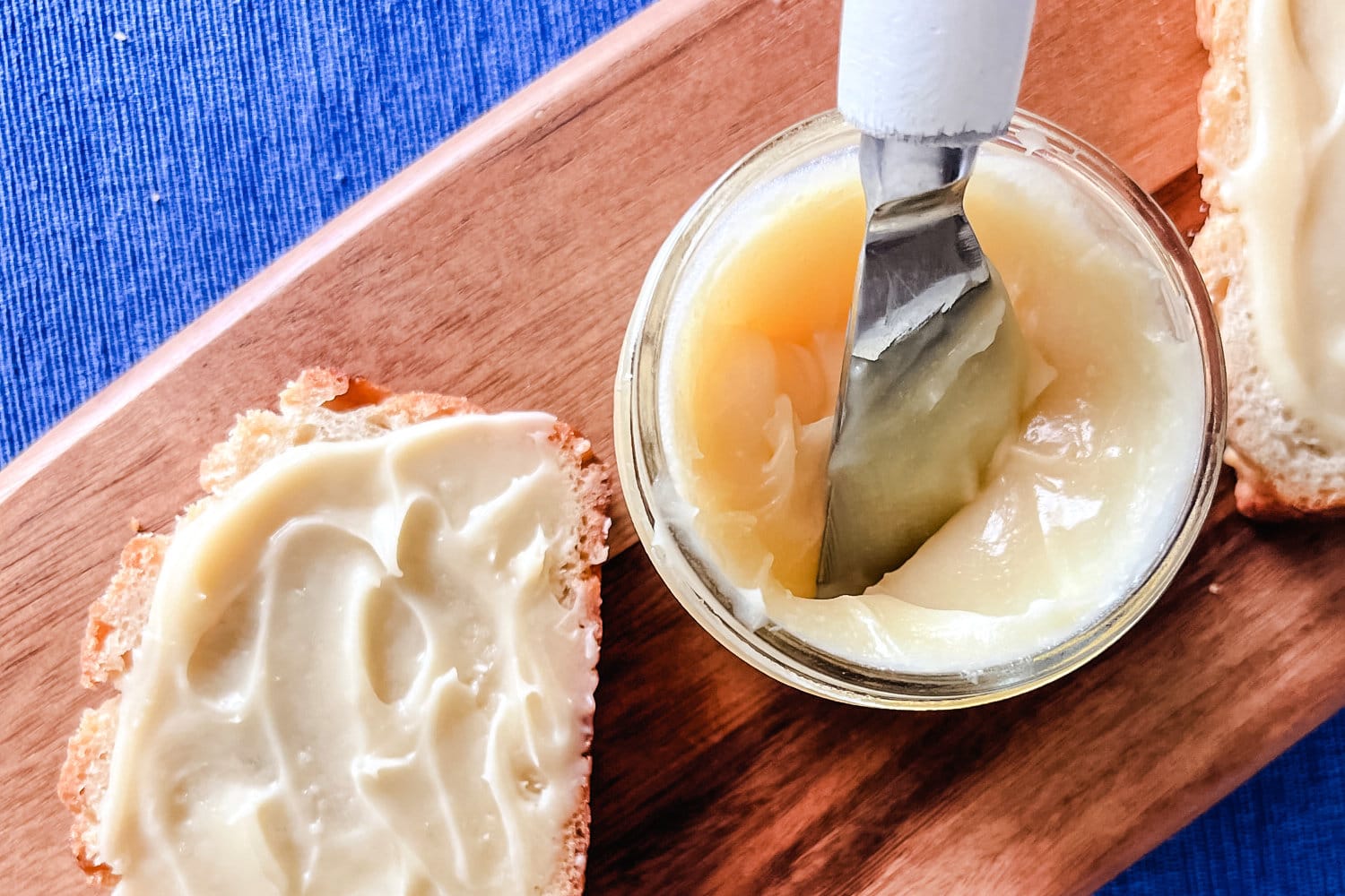 Honey butter spread in a jar with slices of honey butter bread. 