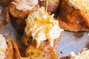 Bacon-wrapped sausage shots with cream cheese and honey.