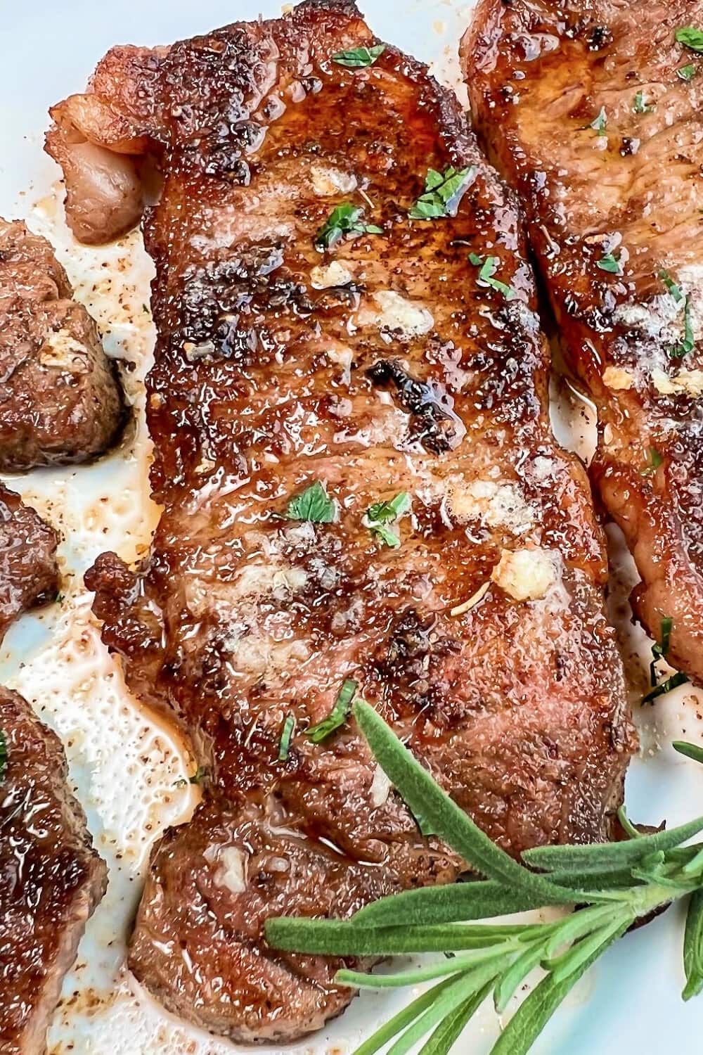 Caramelized sizzle steaks with rosemary. 