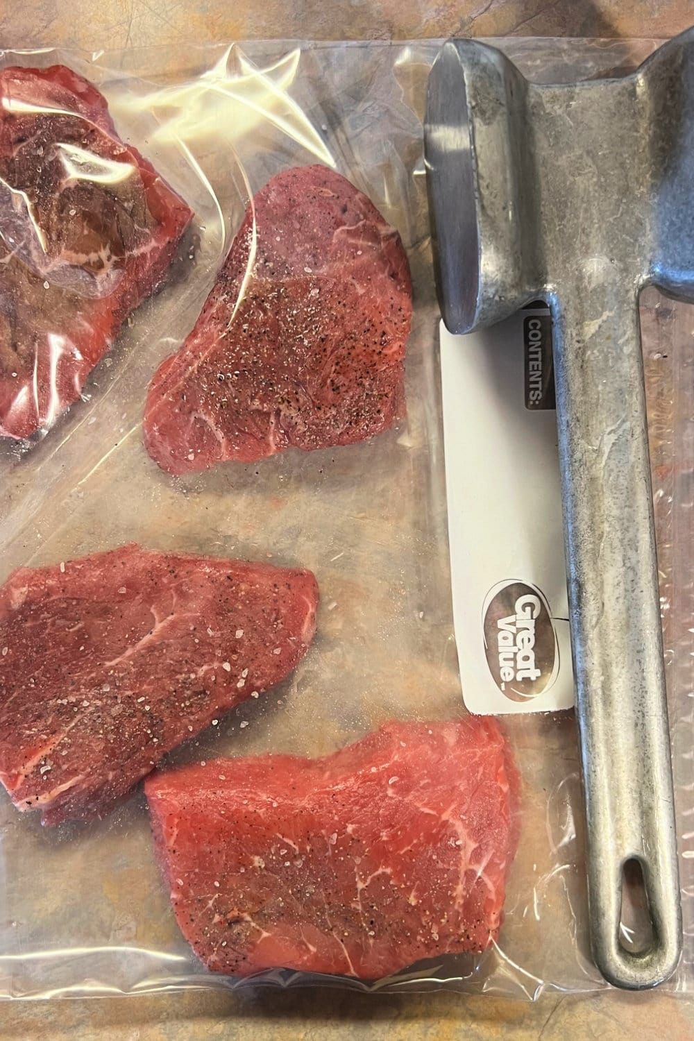 Steaks in a gallon bag to be pounded thin with a meat mallet. 