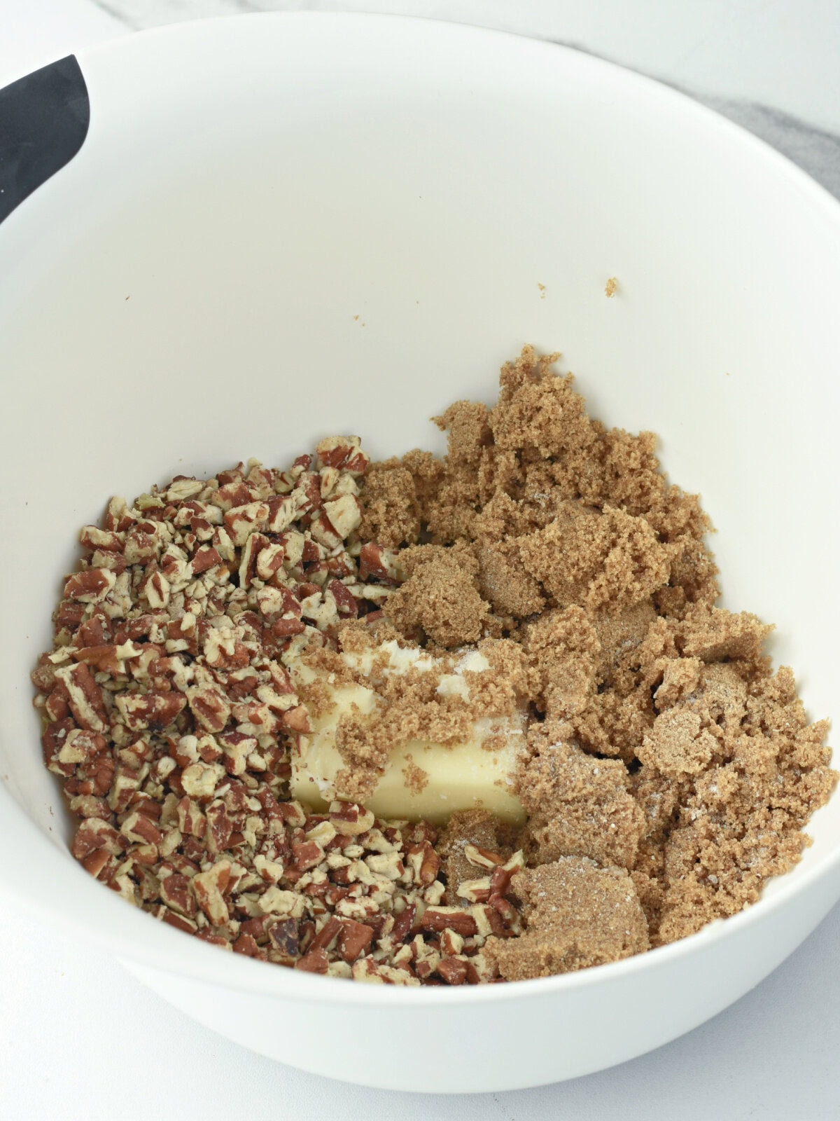 Unmixed filling ingredients in a white bowl. 