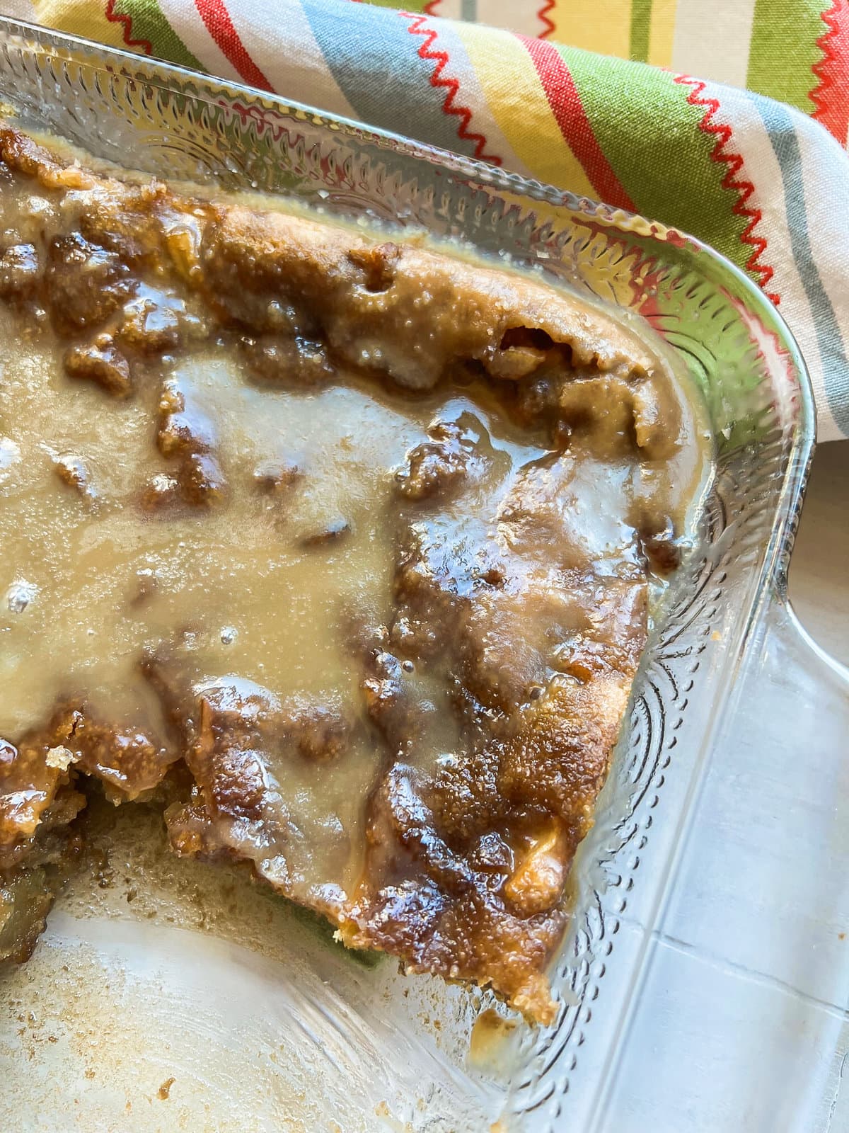 Moist Apple Cake with Caramel Sauce in a baking dish. 