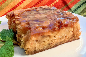 Side view of a fat slice of Super Moist Apple Cake.