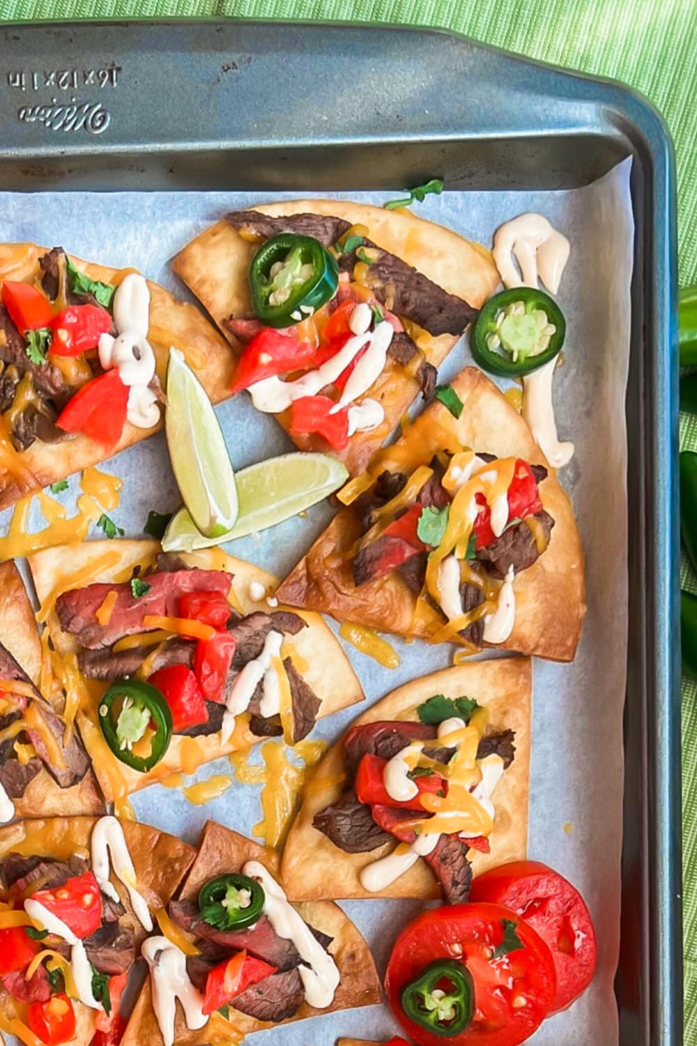 Sizzle Steak Sheet Pan Nachos on a baking sheet. 