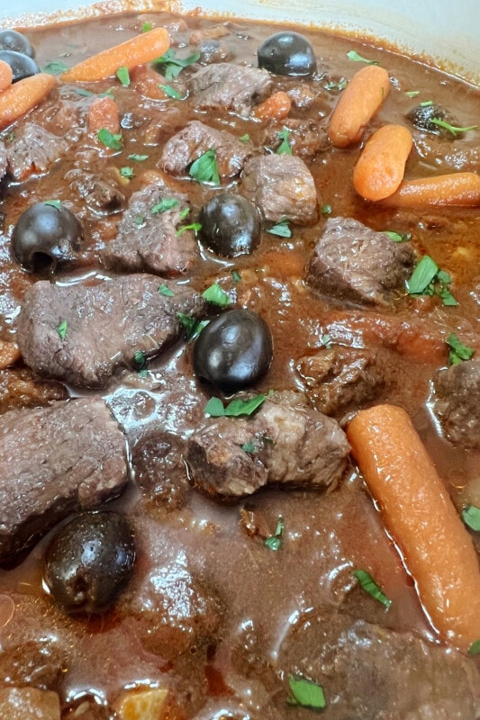 Beef stew simmering until thickened.