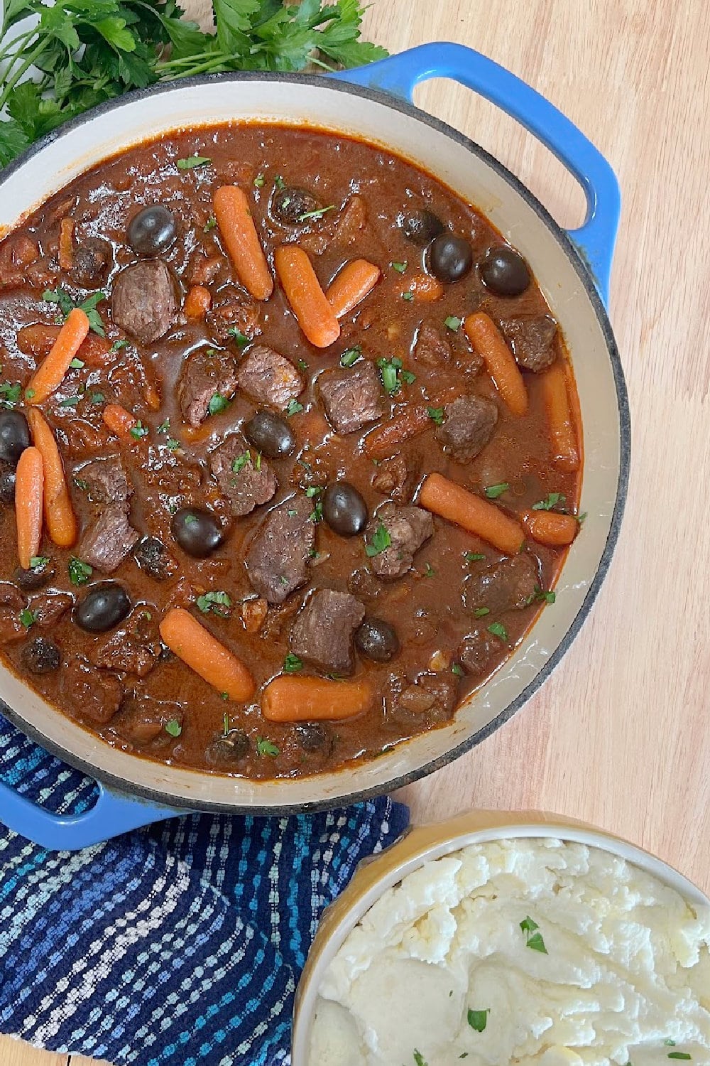 Beef Stew with mashed potatoes in a bowl on the side.