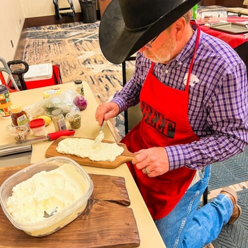 A handsome cowboy making a butter board base. 