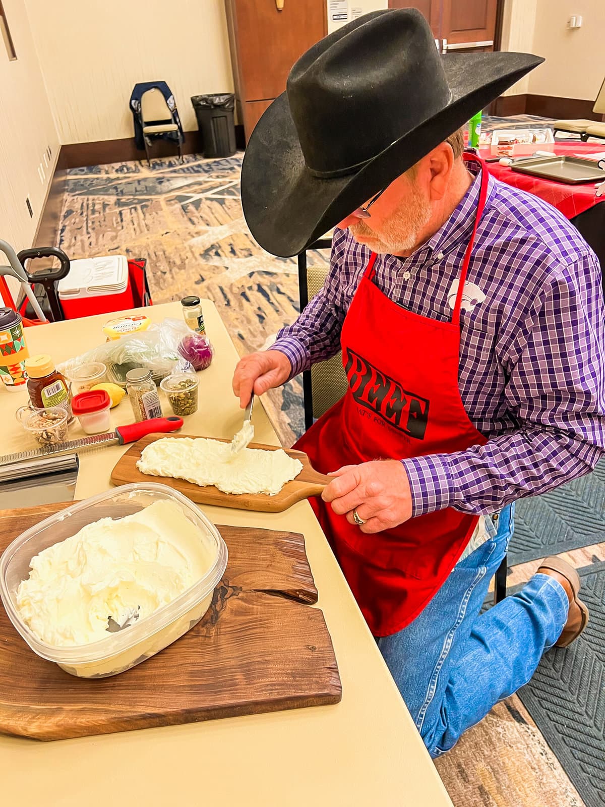 A handsome cowboy making a butter board base. 
