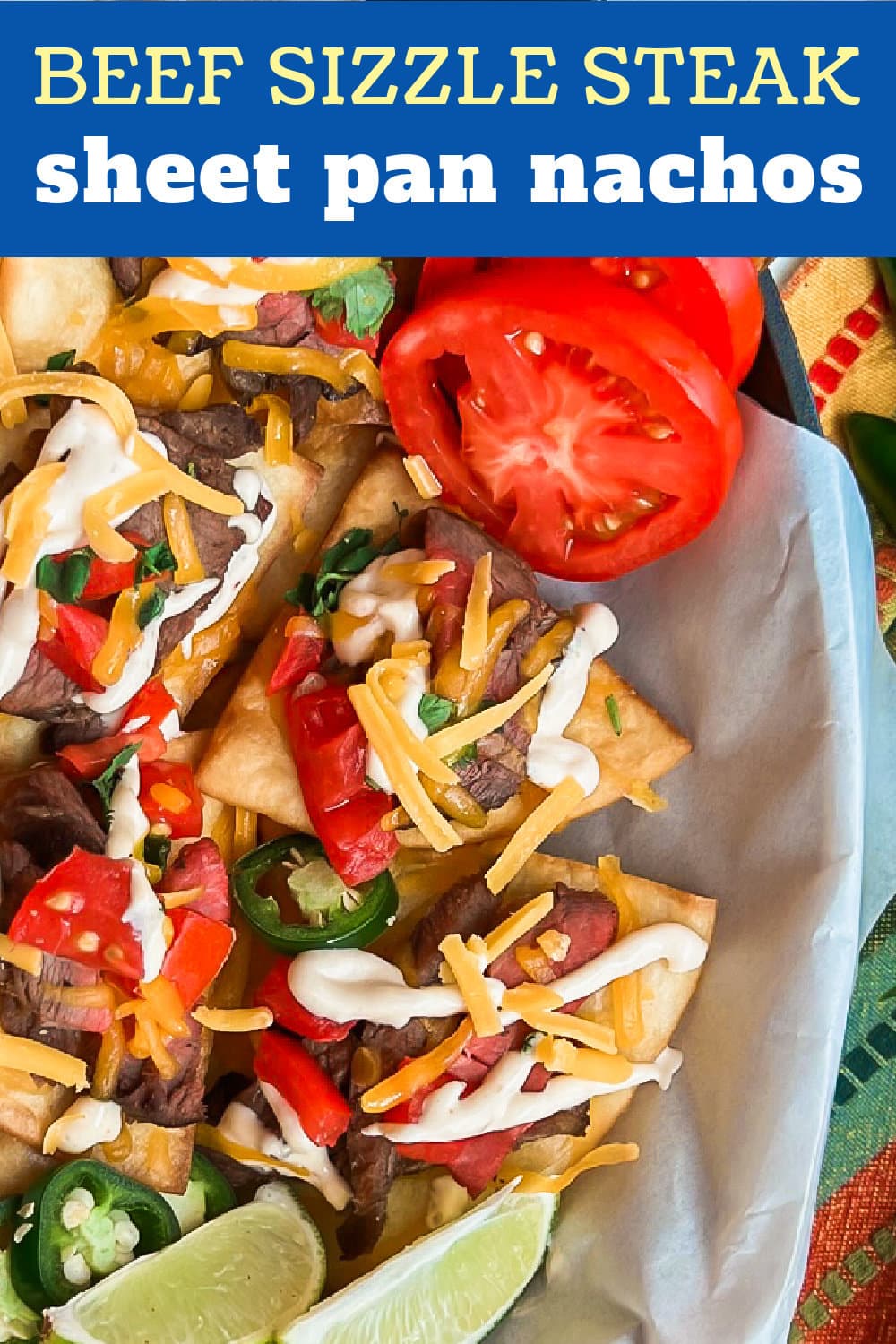 Loaded Beef Sizzle Steak Sheet Pan Nachos with toppings. 