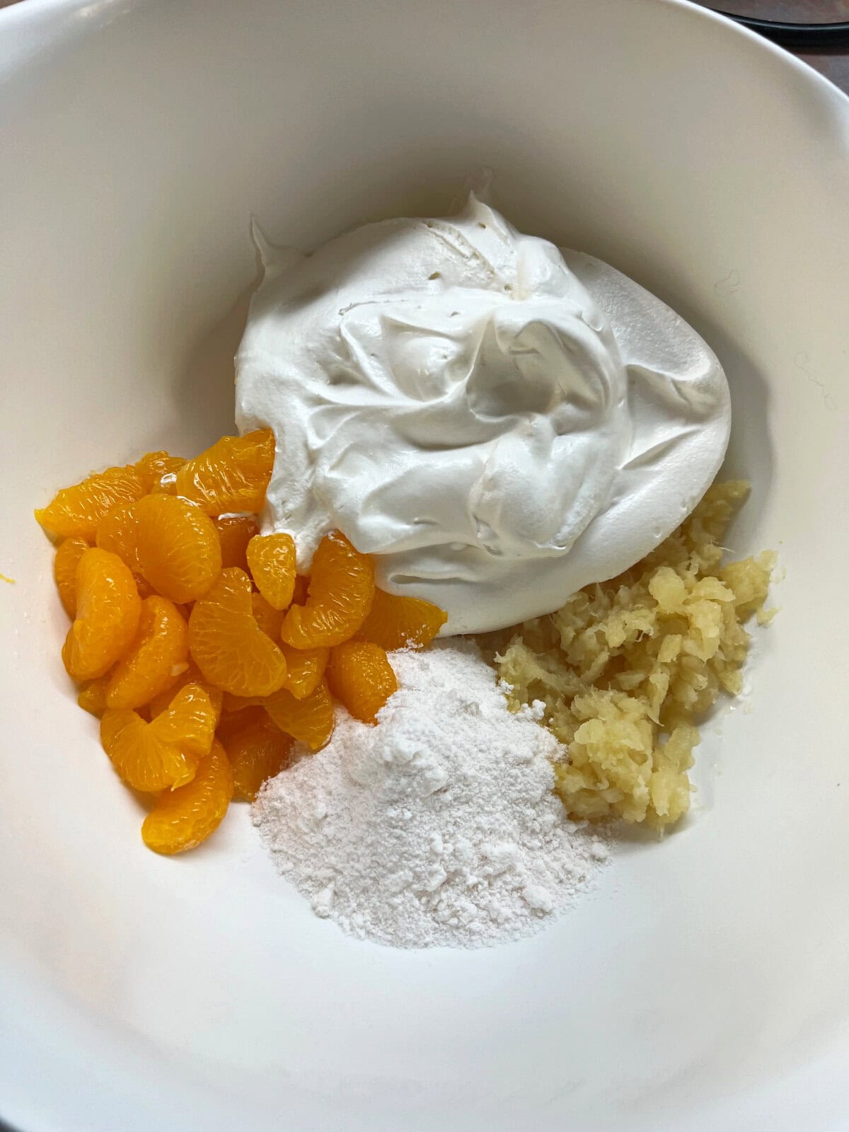 Mandarin oranges, mayonnaise, pineapple juice, crushed pineapple juice, eggs. 