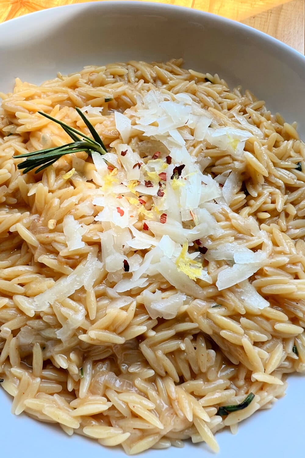 Browned butter orzo with parmesan on top. 