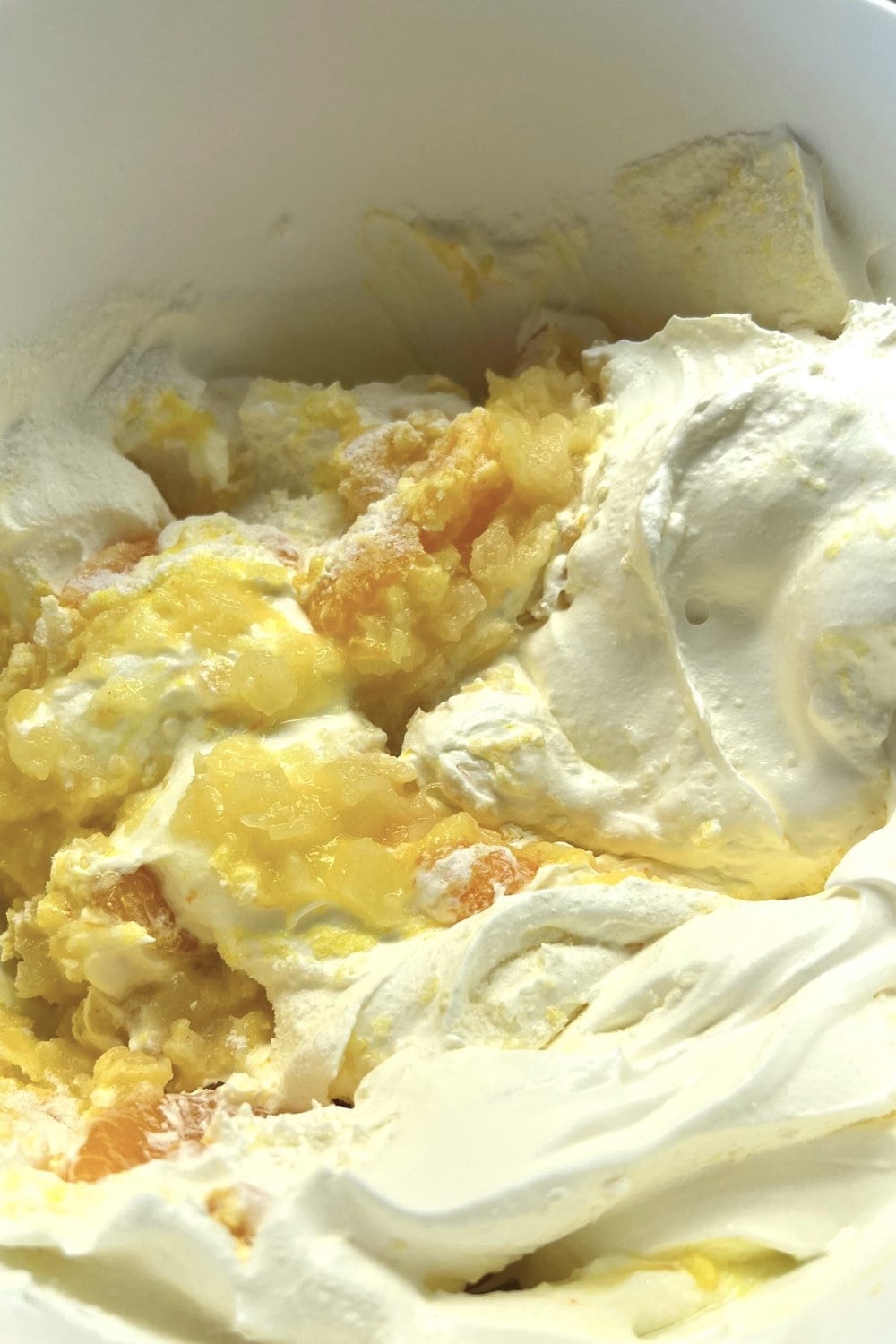 Folding the Sunshine cake ingredients together. 