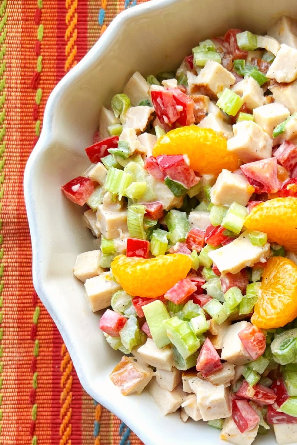 Easy and fresh, Tropical Turkey Salad in a white serving bowl. 