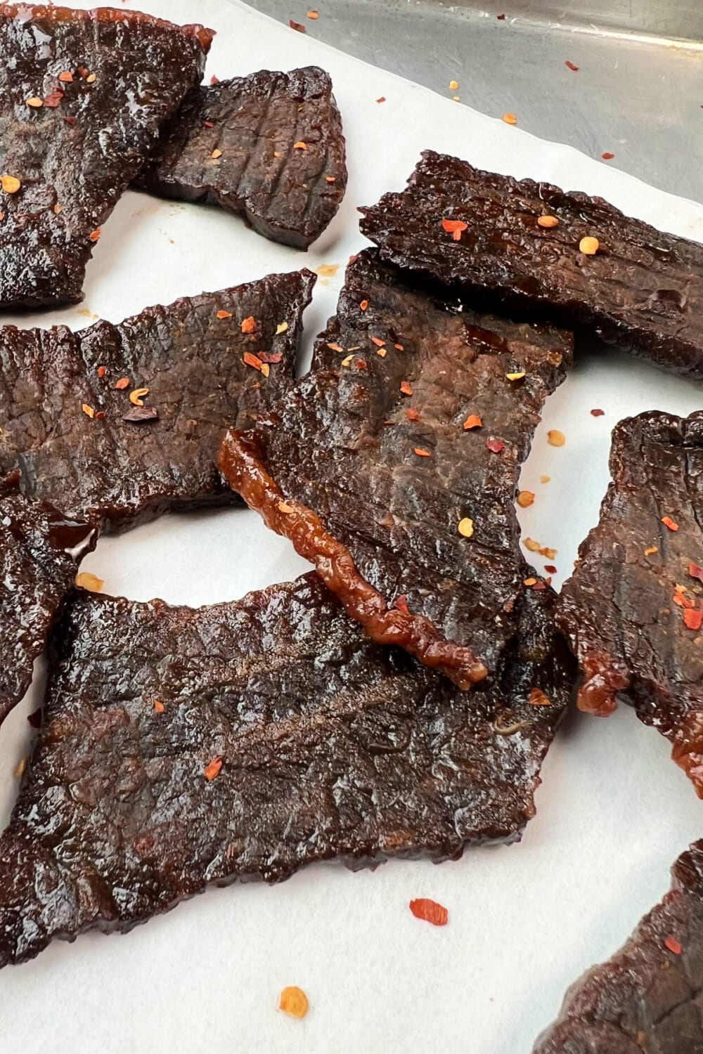 Slices of fully cooked jerky on a platter. 