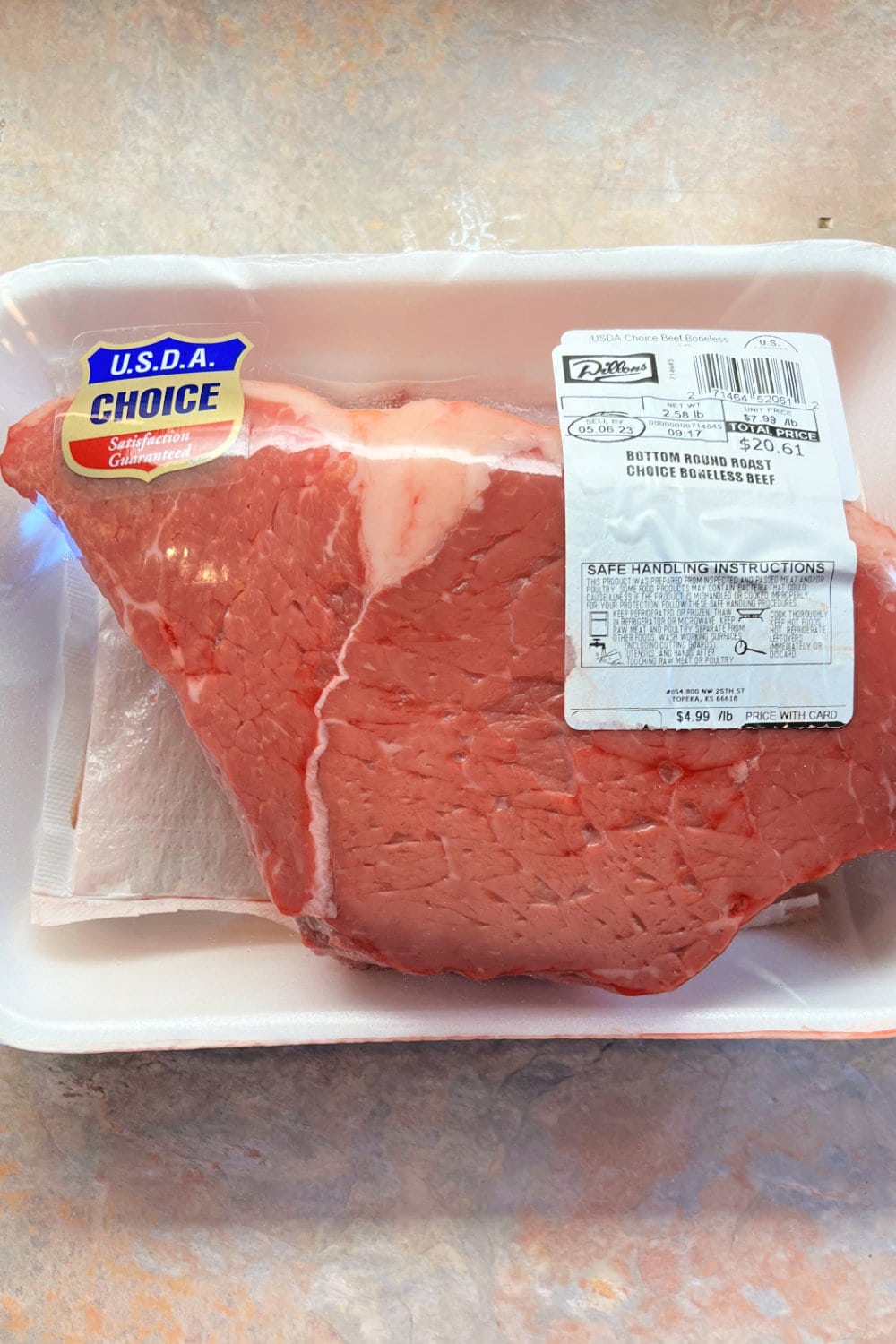 Bottom round roast in meat packaging. 
