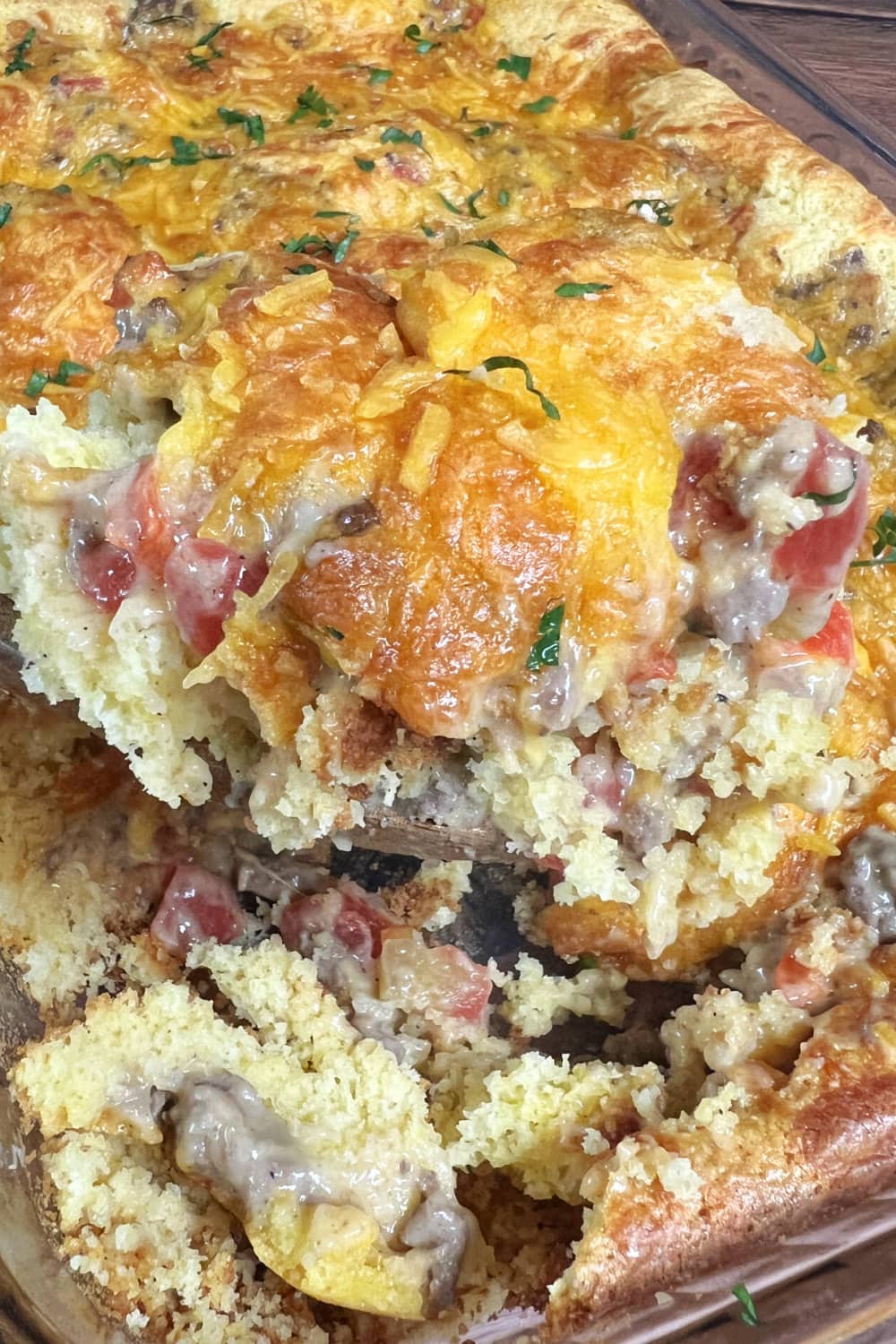 Serving up the warm Cowboy Cornbread Casserole from the pan. 
