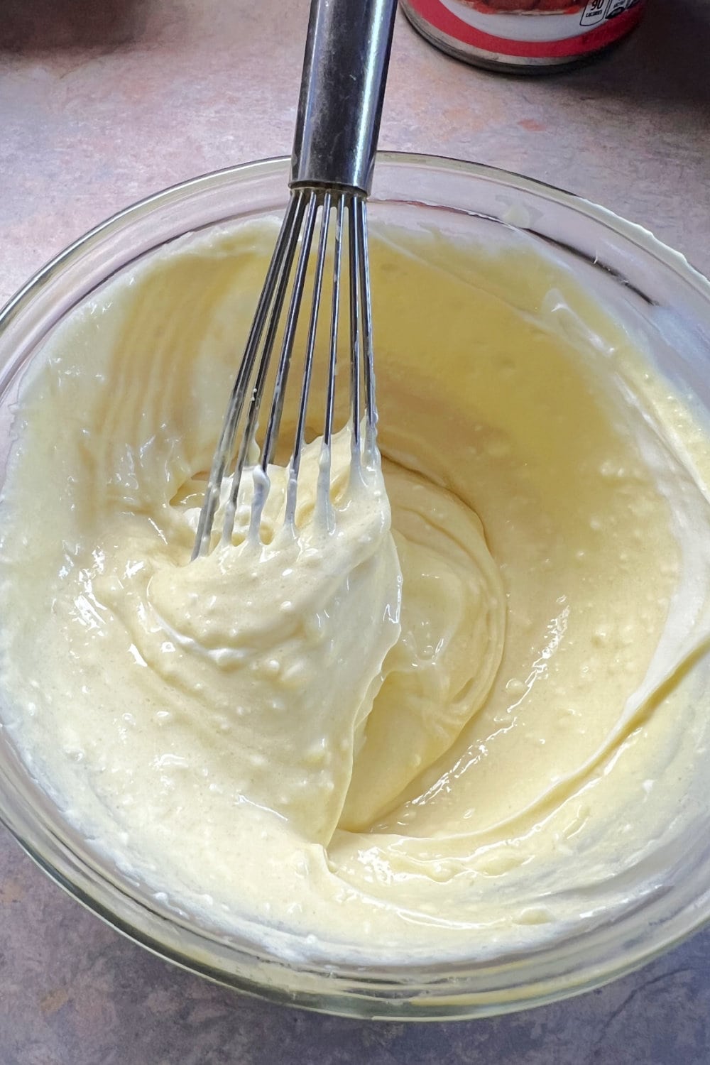 Cream cheese filling in a mixing bowl, smooth and incorporated. 
