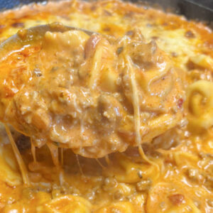 Hot and bubbly, Tortellini in Creamy Meat Sauce is ready to be served.