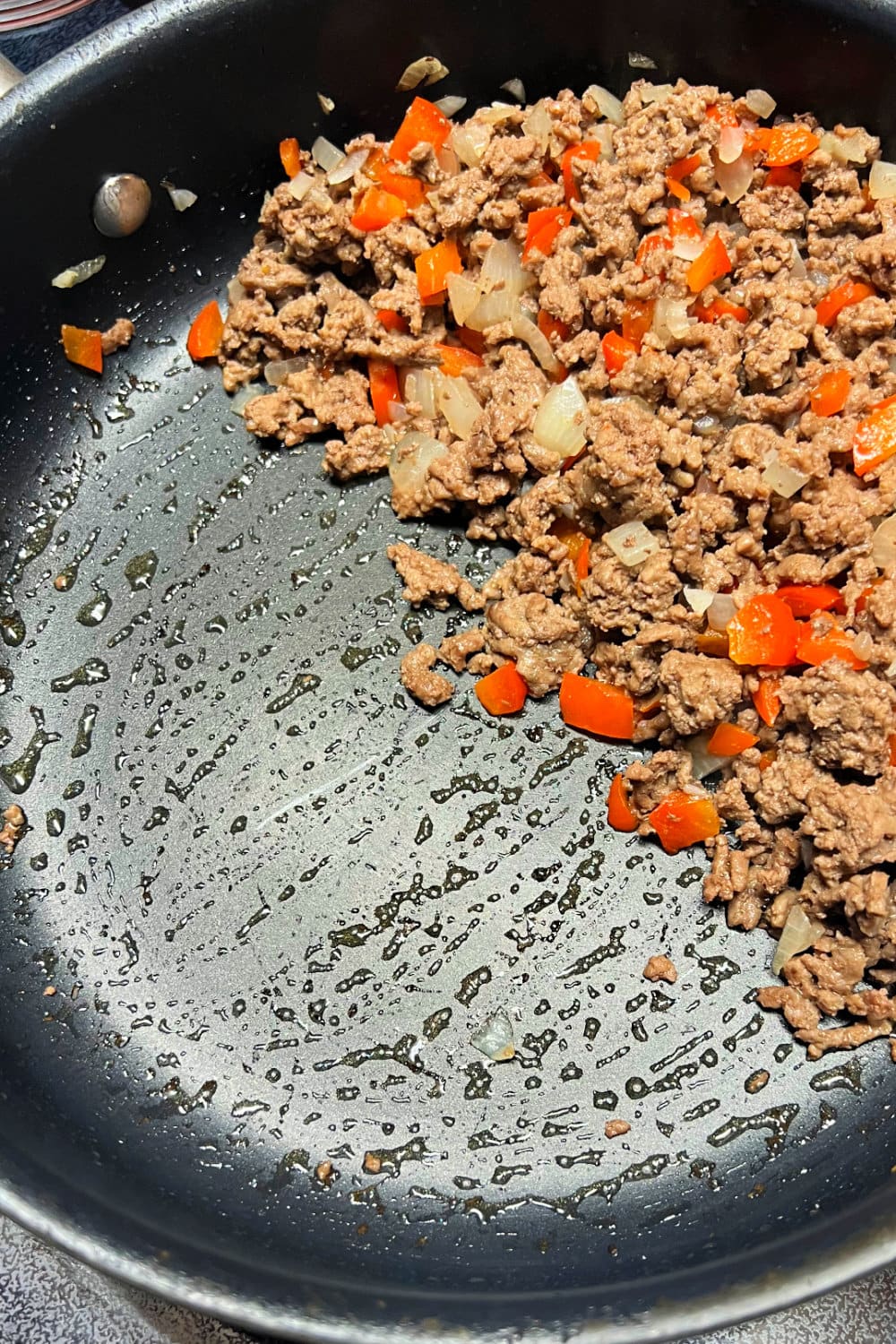 Browned ground beef with peppers and onions. 