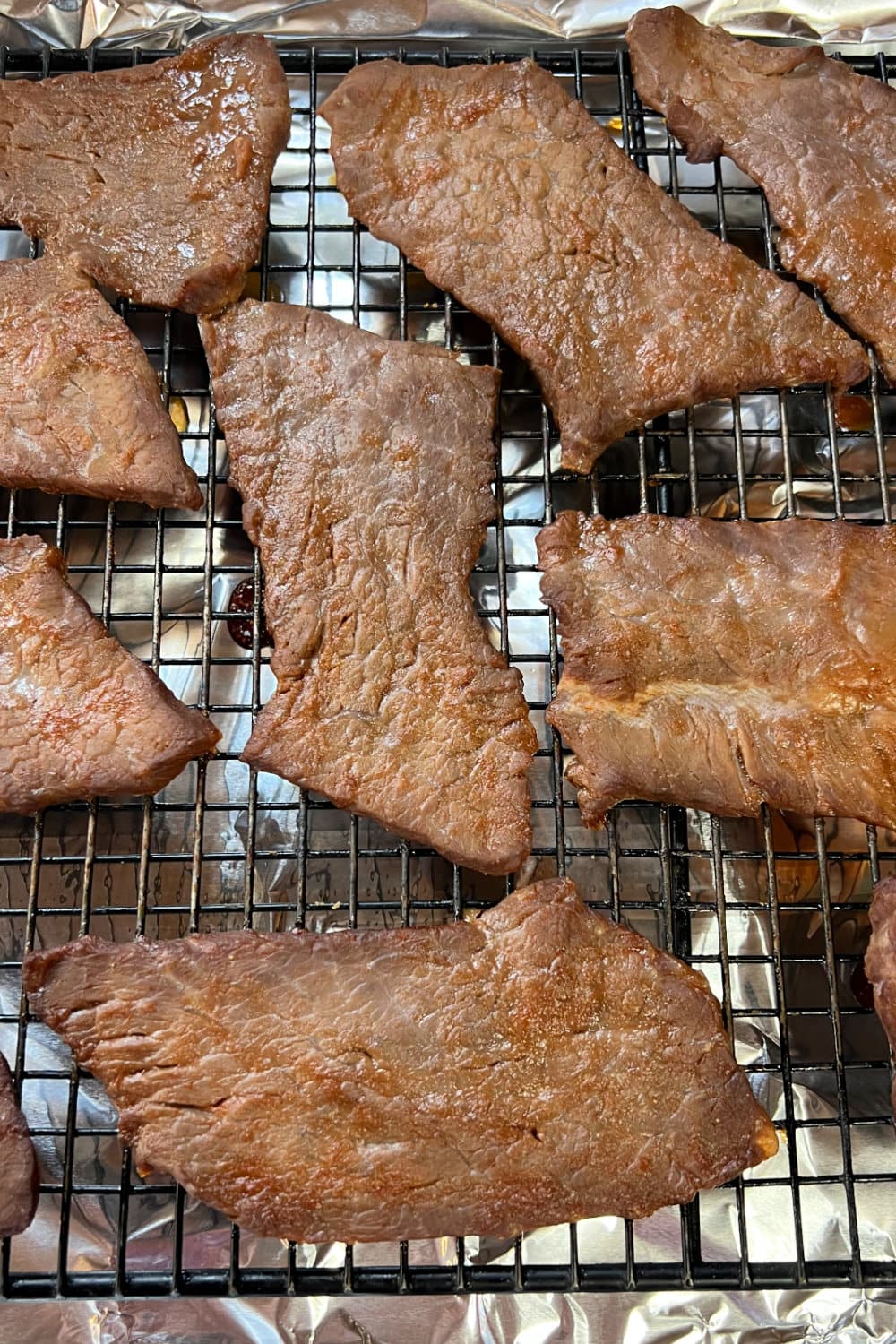 Jerky that is partially cooked but not yet flipped over. 