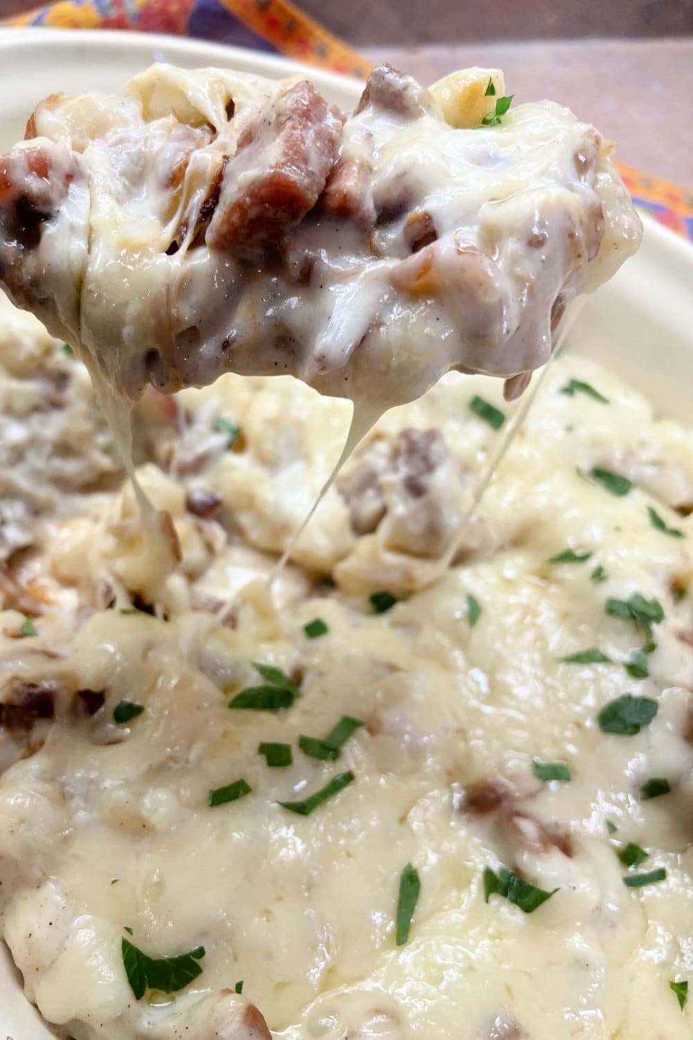 Rich and creamy Ham Steak and Potato Casserole hot from the oven. 