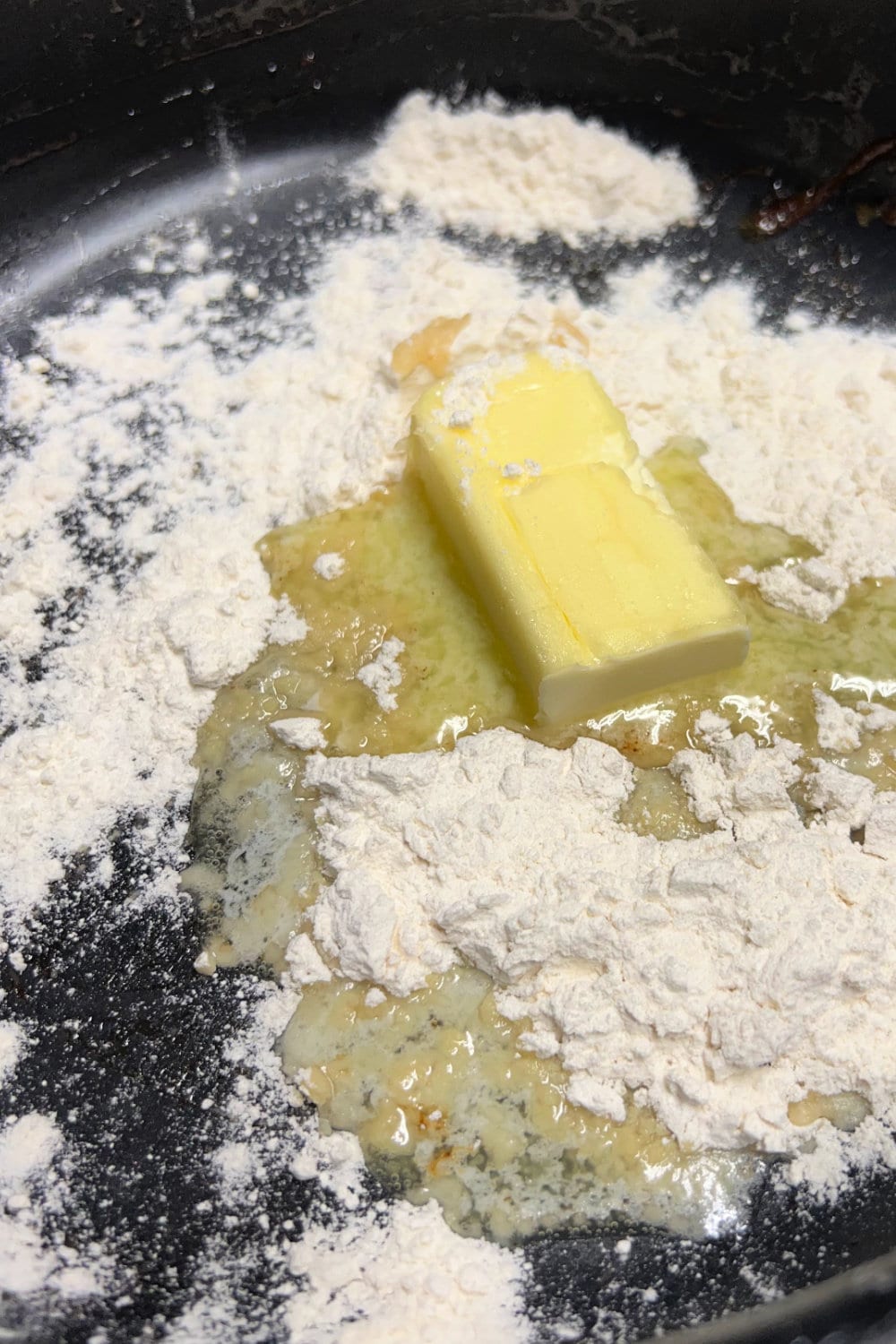 Butter and flour in a skillet to make a roux.