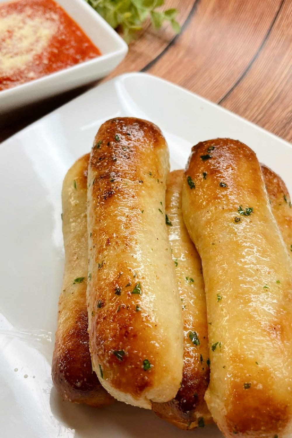 Air fryer pizza bread sticks served with warm pizza sauce. 