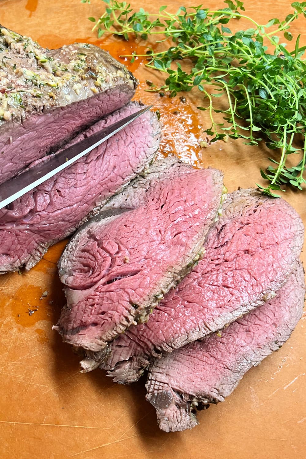 Slicing up a perfect medium-rare beef tenderloin to serve. 