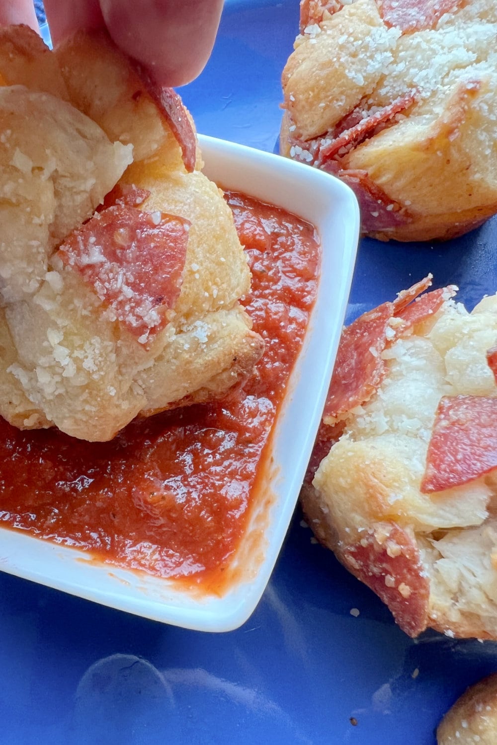 Pepperoni Biscuit Bites dipped in warm pizza sauce. 