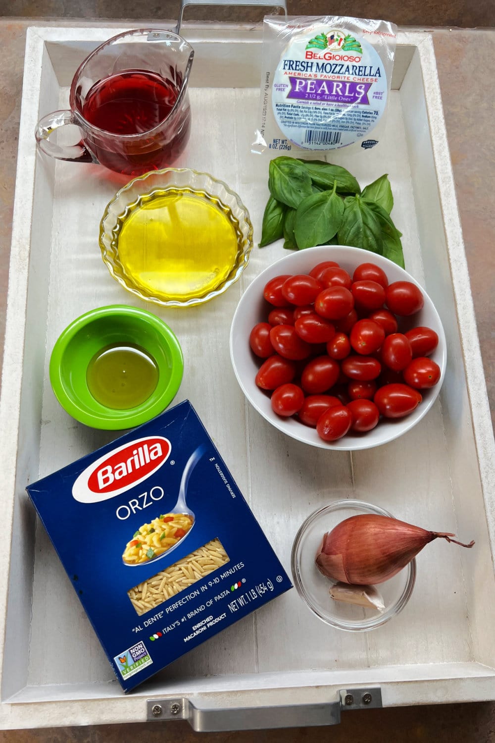 All the ingredients needed to make Caprese Orzo Salad. 