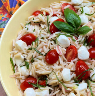 A bowl of Caprese Orzo Salad ready to be served.