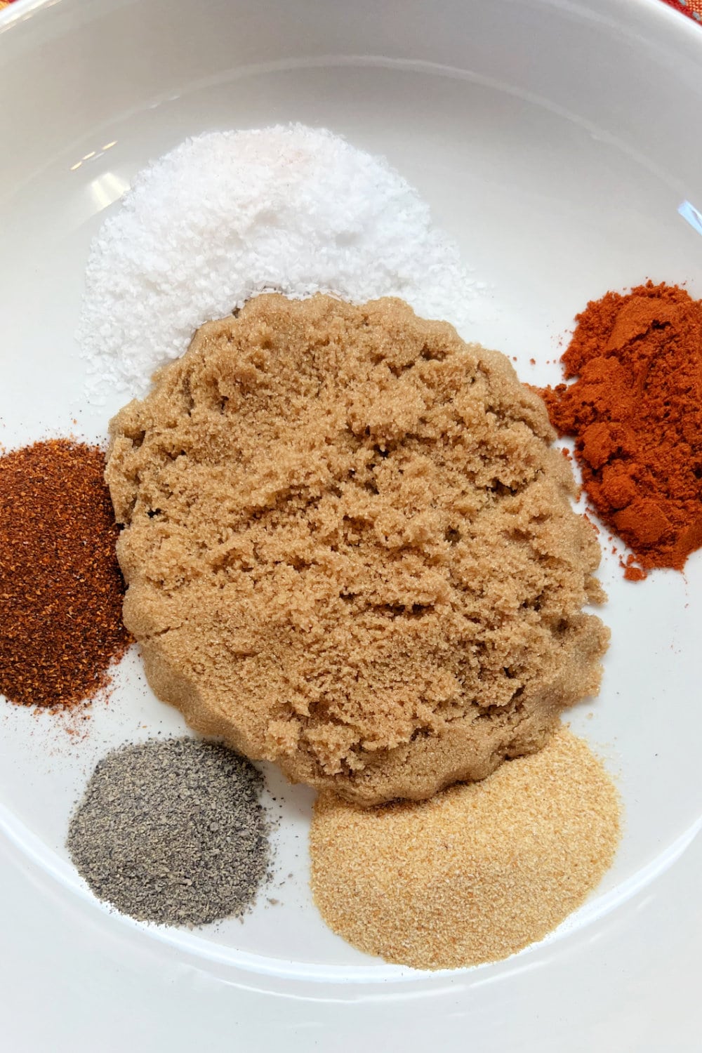 The spices that make up beef tenderloin rub all in a white bowl. 