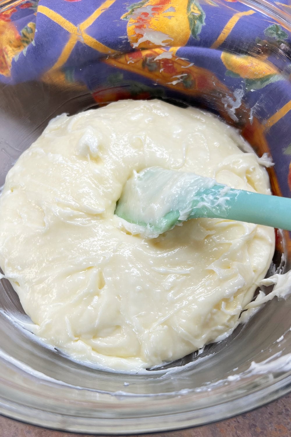 Creamy frosting ready to be spread over TikTok Cinnamon Rolls. 