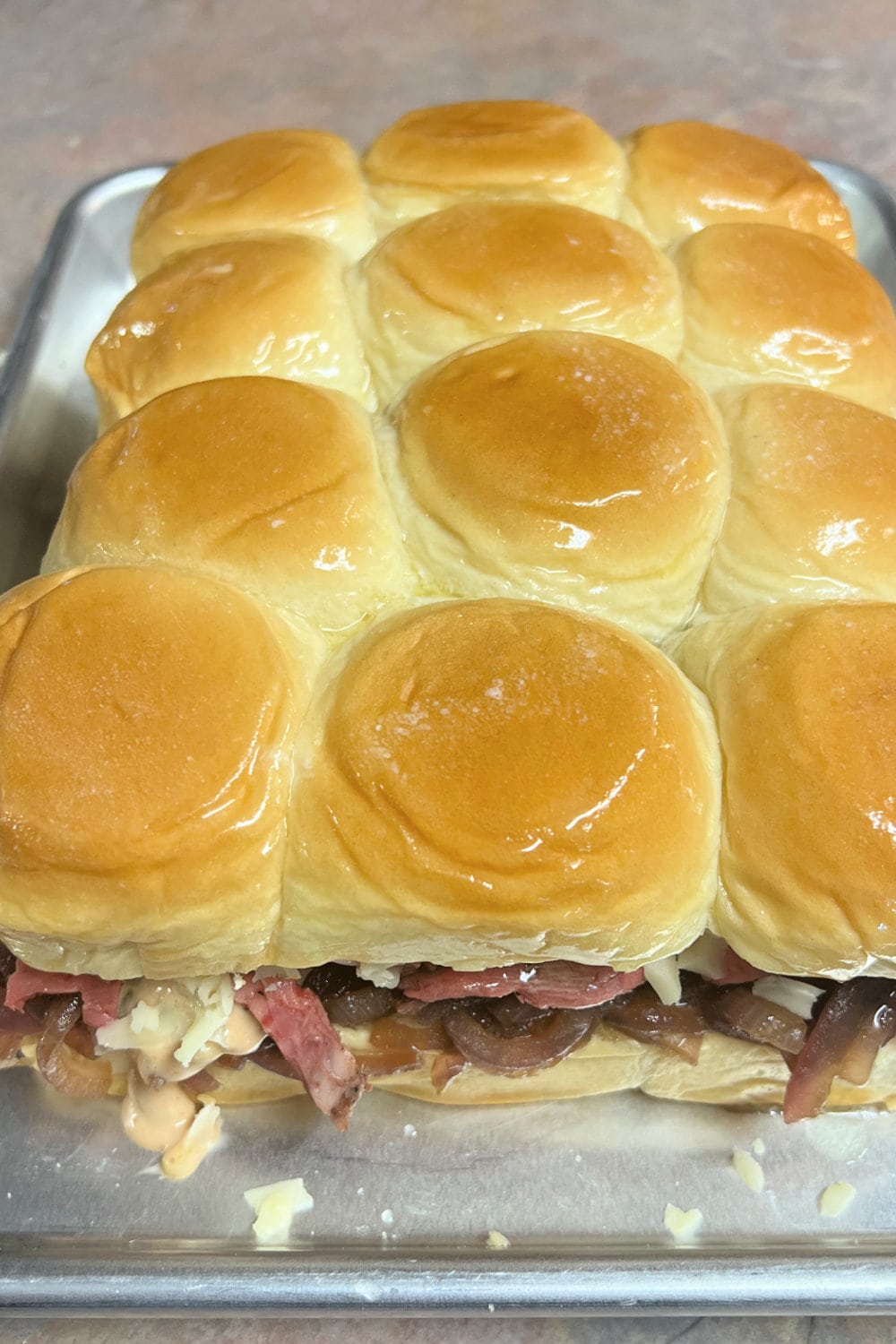 Beef Tenderloin Sliders brushed with melted butter. 