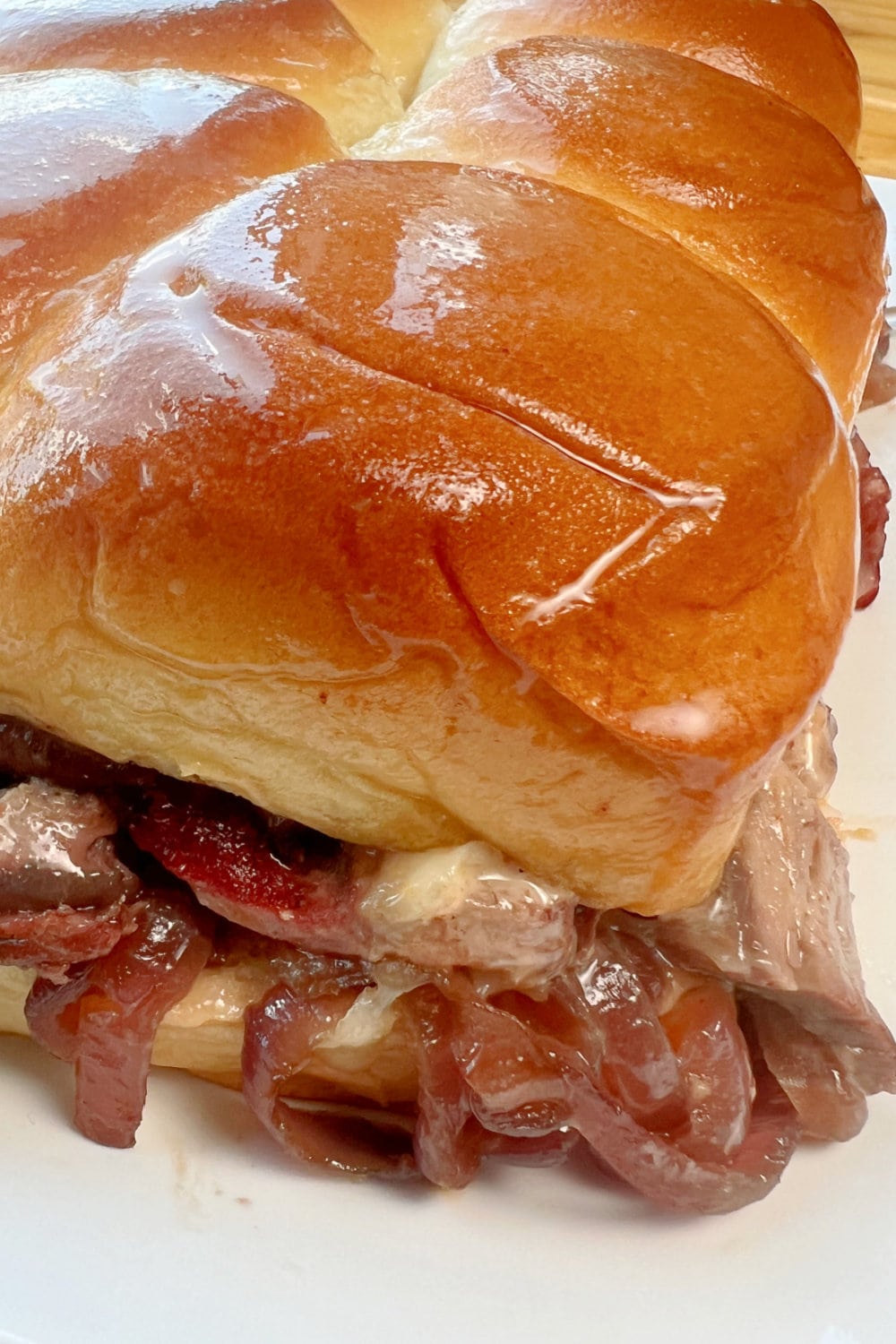 A golden brown Beef Tenderloin Slider ready to be enjoyed. 