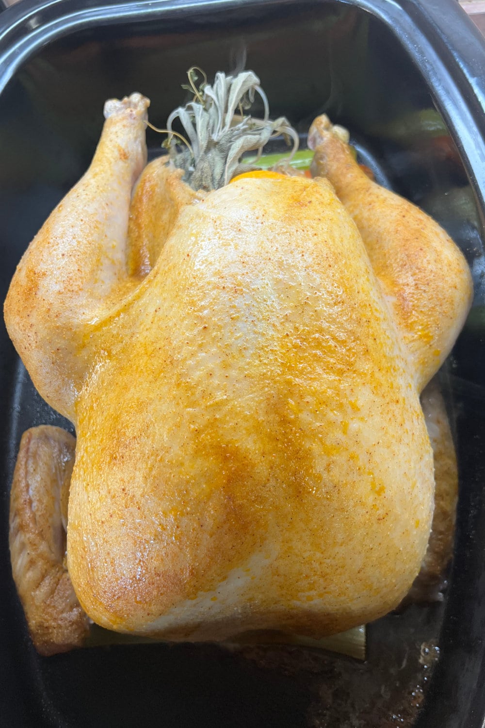 A seasoned fresh turkey ready for the roaster.