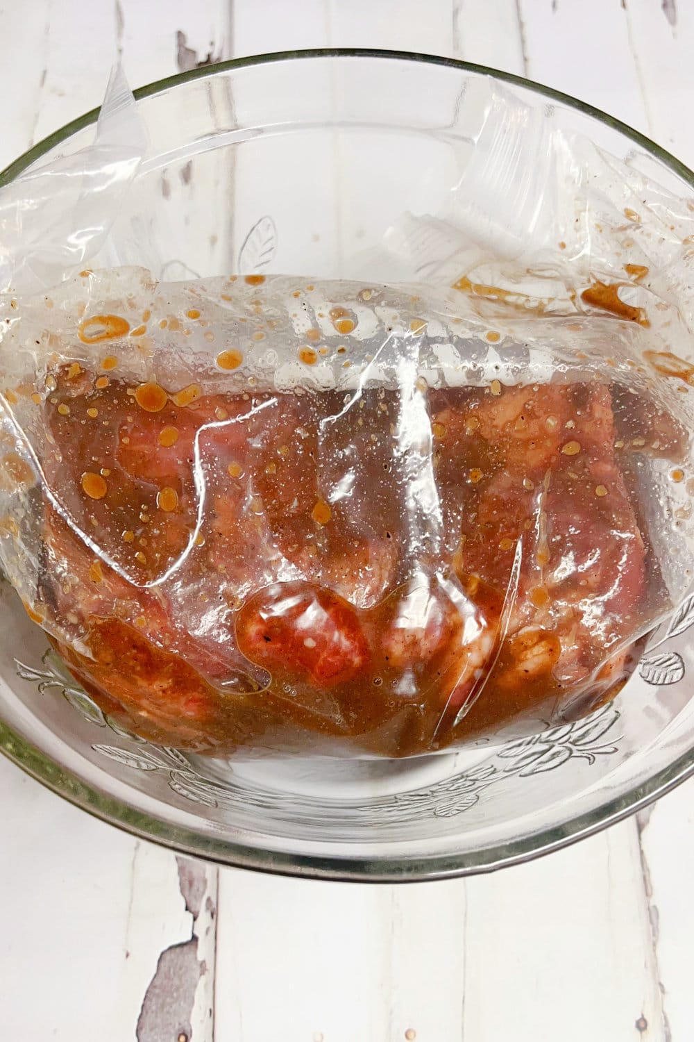 Beef tenderloin marinating in a gallon bag. 