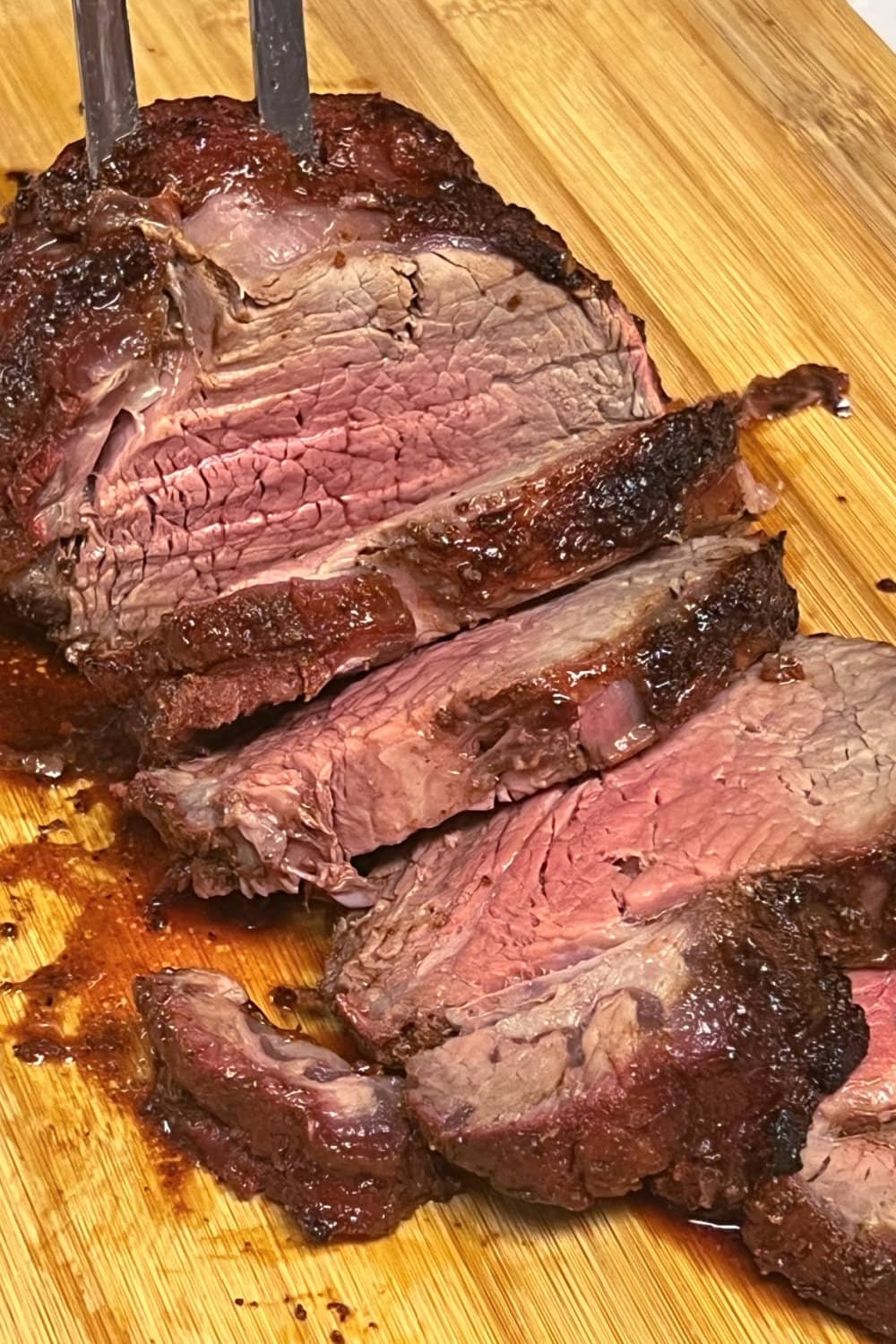 Beef tenderloin cooked to medium-rare and sliced. 