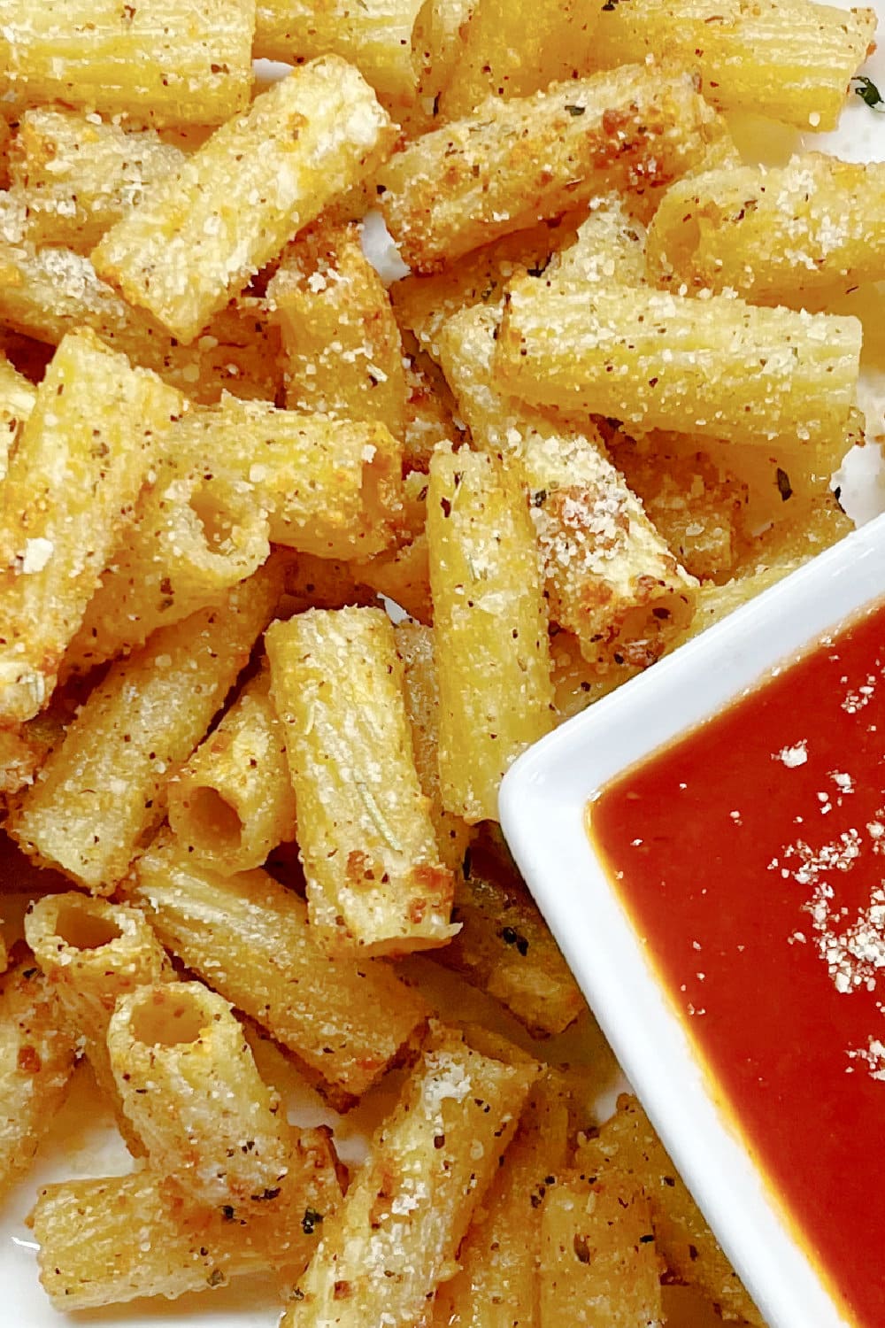 Crispy, golden brown air fryer pasta chips with dipping sauce. 