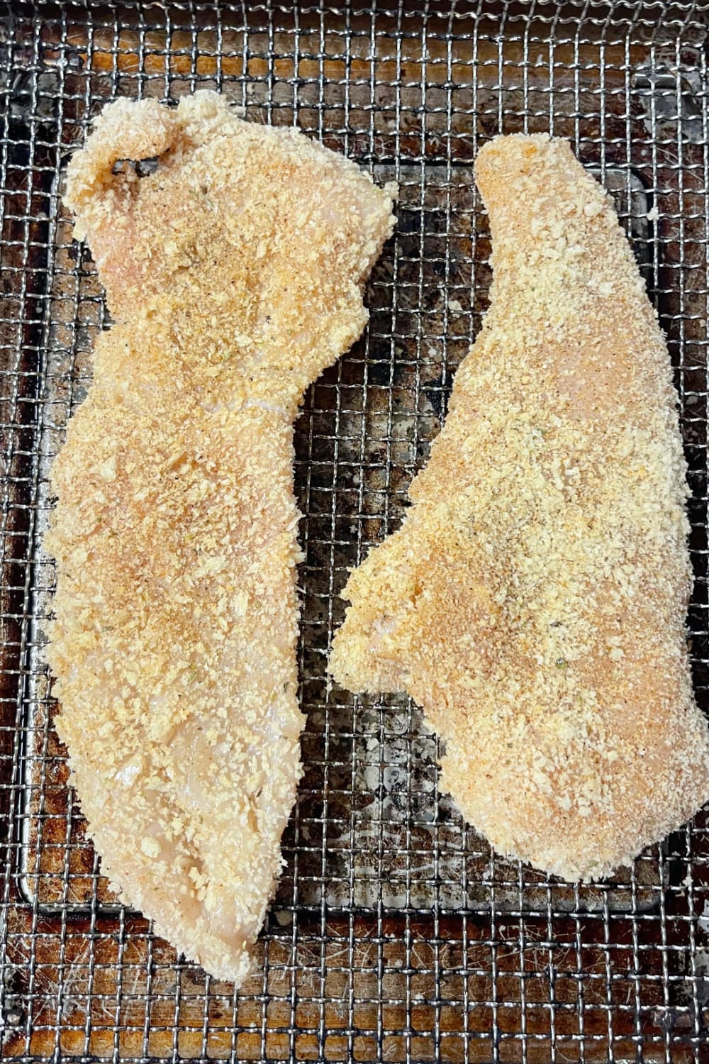 Breaded chicken cutlets ready to be air fried for a few minutes. 