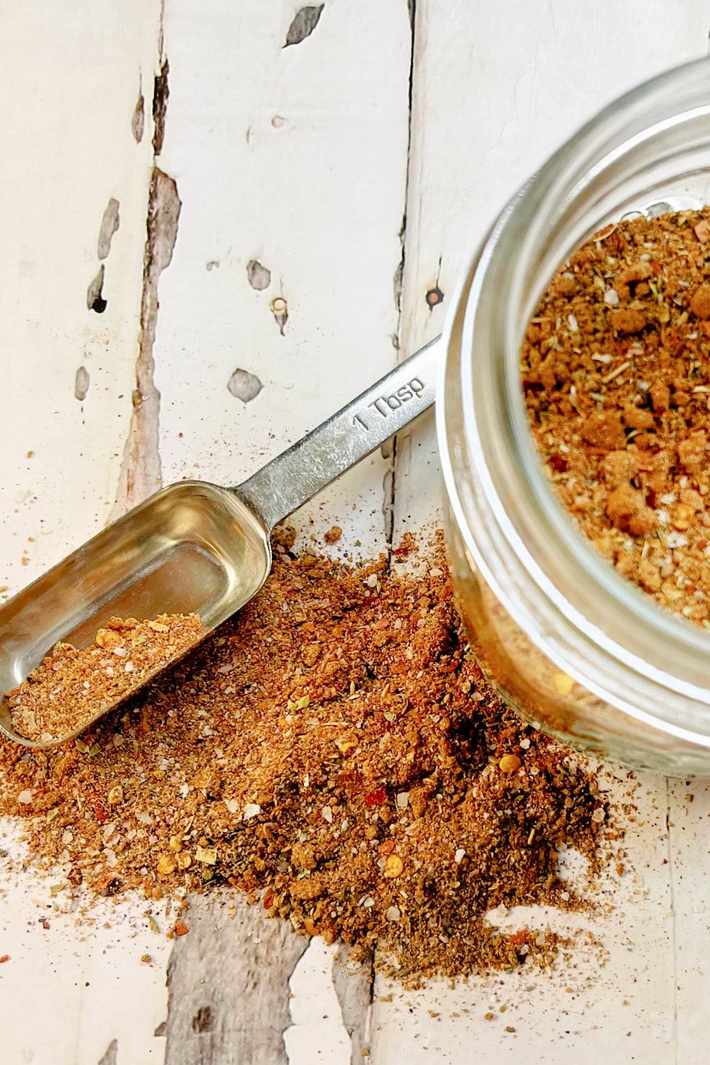 Mexican Seasoning on a table top with a measuring spoon. 