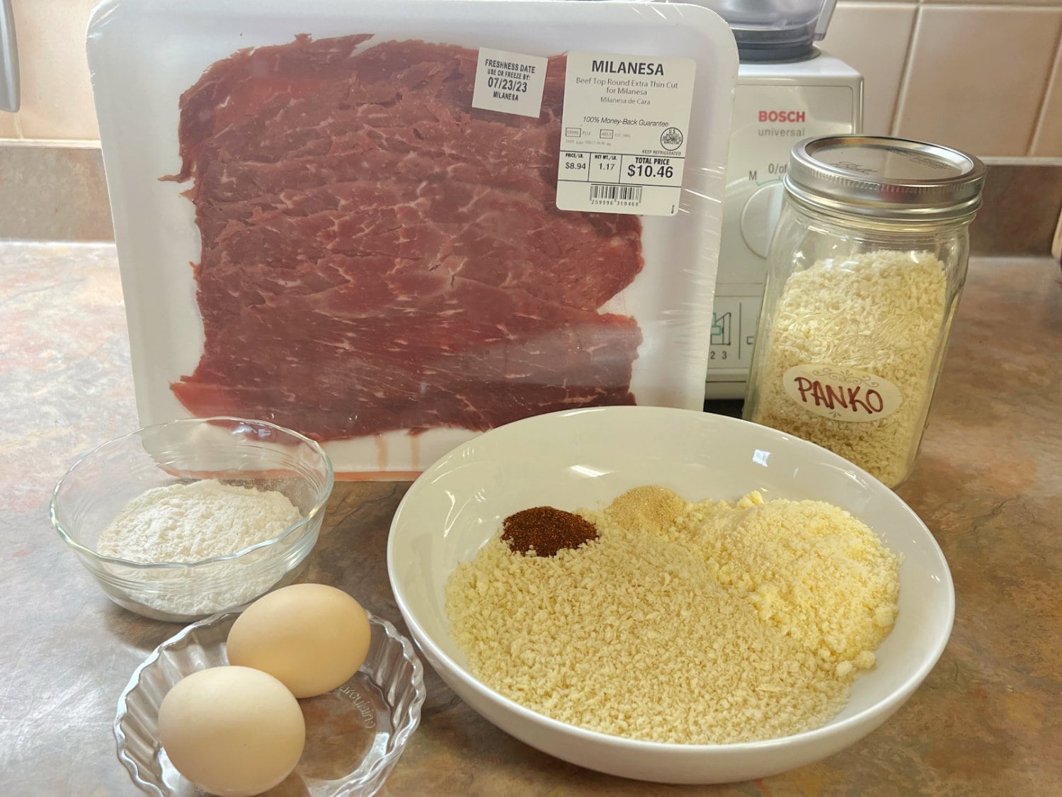All the ingredients needed to make Steak Milanesa.