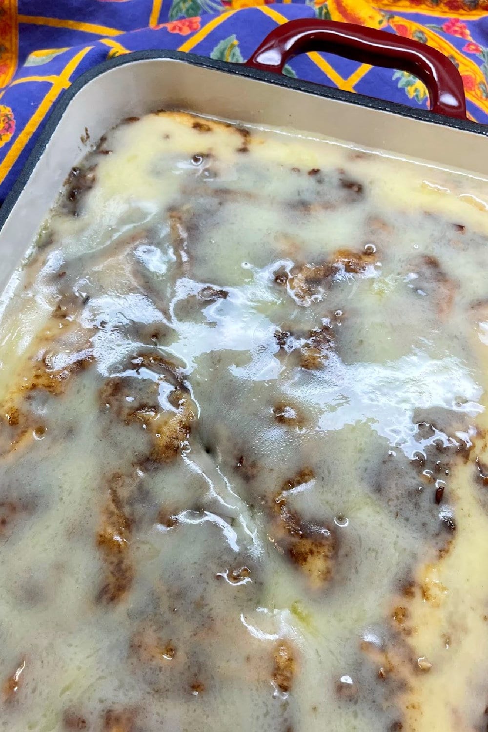A freshly glazed warm Honey Bun Cake. 