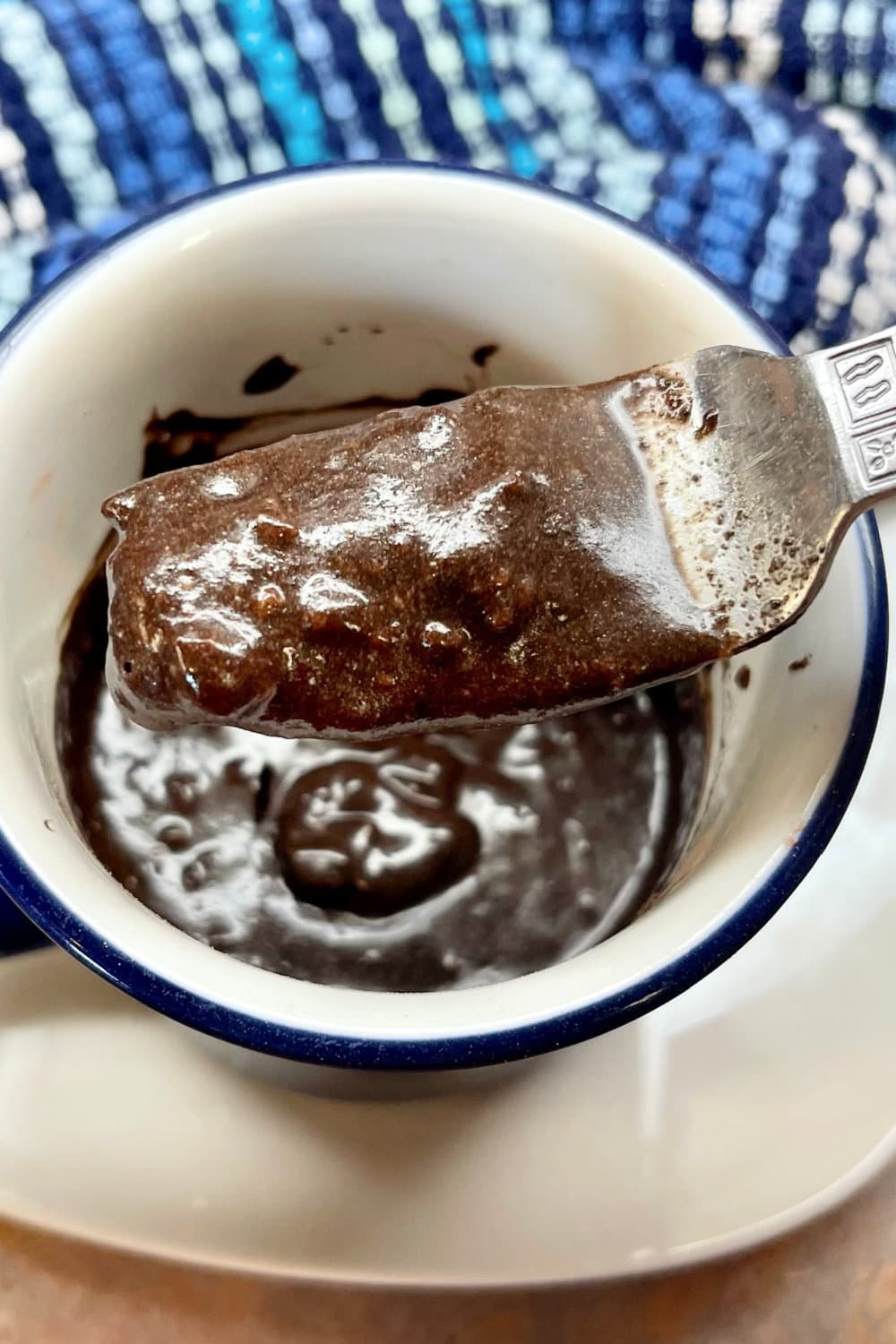 Thick Oreo Mug Cake batter in a cup. 